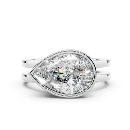 Pear-shaped diamond engagement ring with split shank white gold band