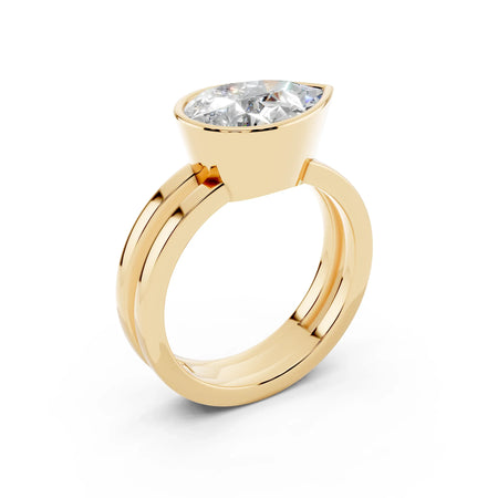Yellow gold ring with marquise-cut diamond solitaire, modern wide band design
