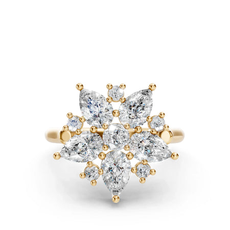 Gold ring with marquise and round diamonds arranged in a floral cluster setting
