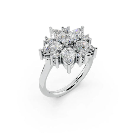 Cluster diamond engagement ring with pear and round cut stones in white gold setting