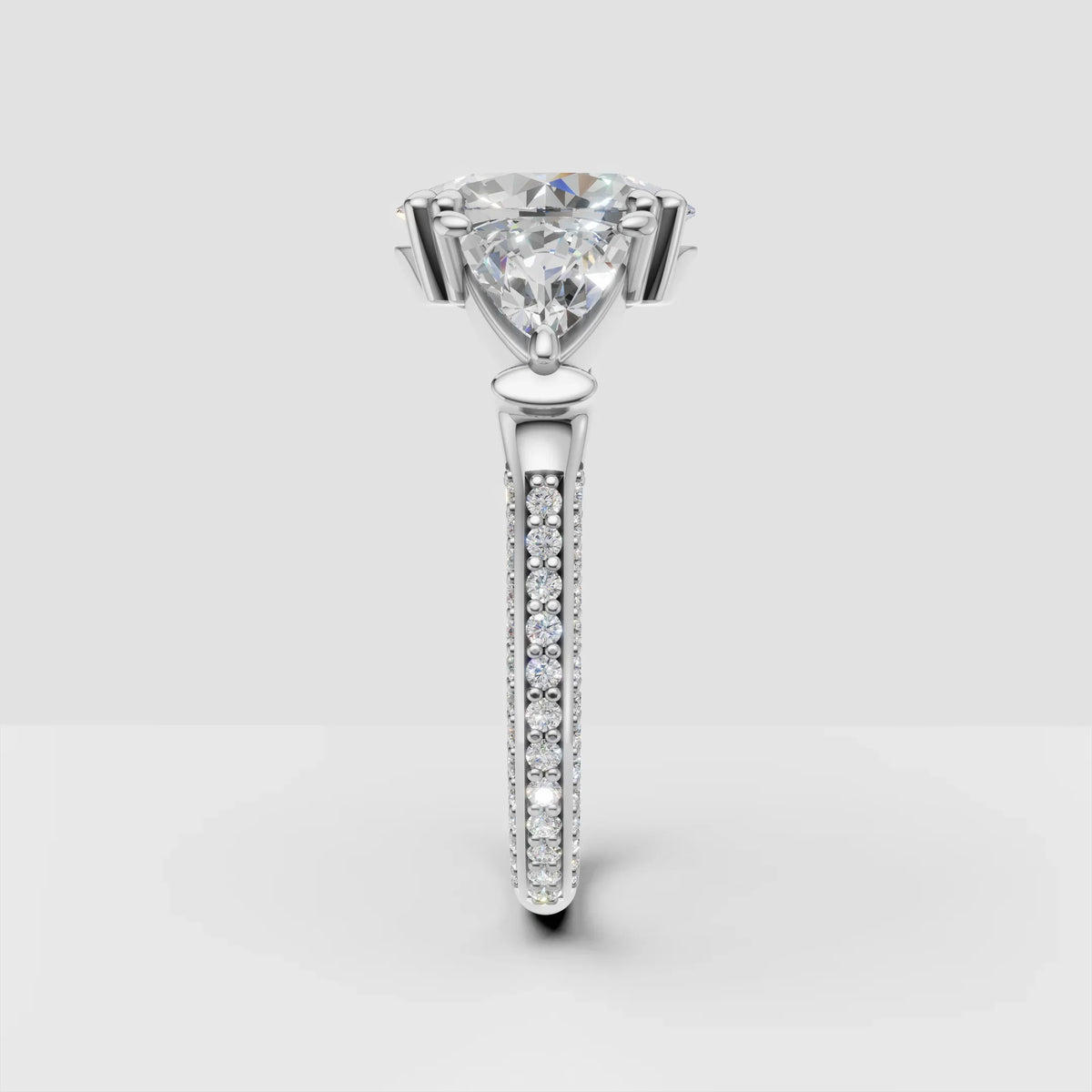 Trillion cut diamond engagement ring with pavé band in white gold, custom jewelry design