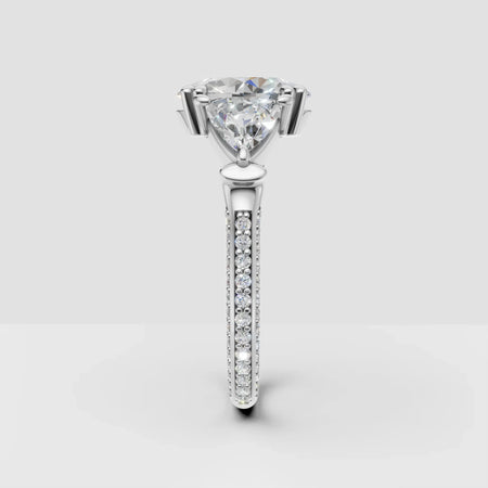 Trillion cut diamond engagement ring with pavé band in white gold, custom jewelry design