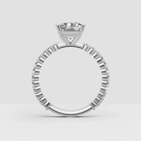 Elegant white gold engagement ring with round diamond center and pavé band