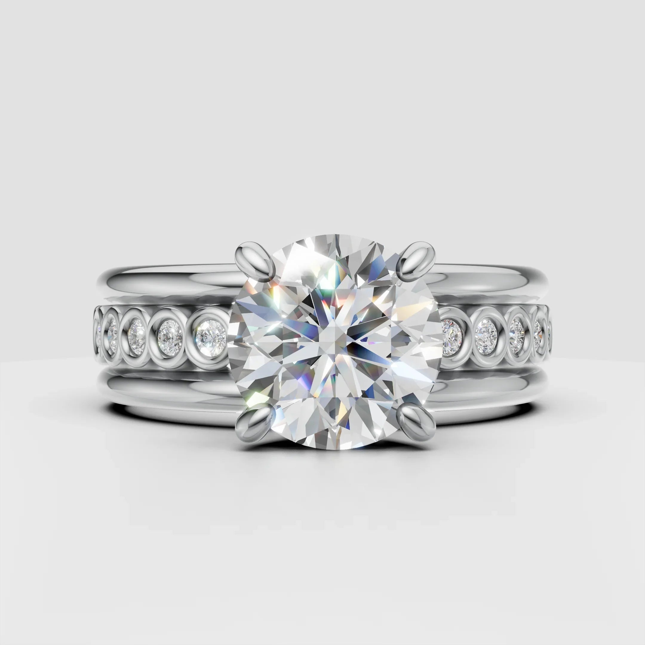 Platinum engagement ring set with large round center diamond and pave band