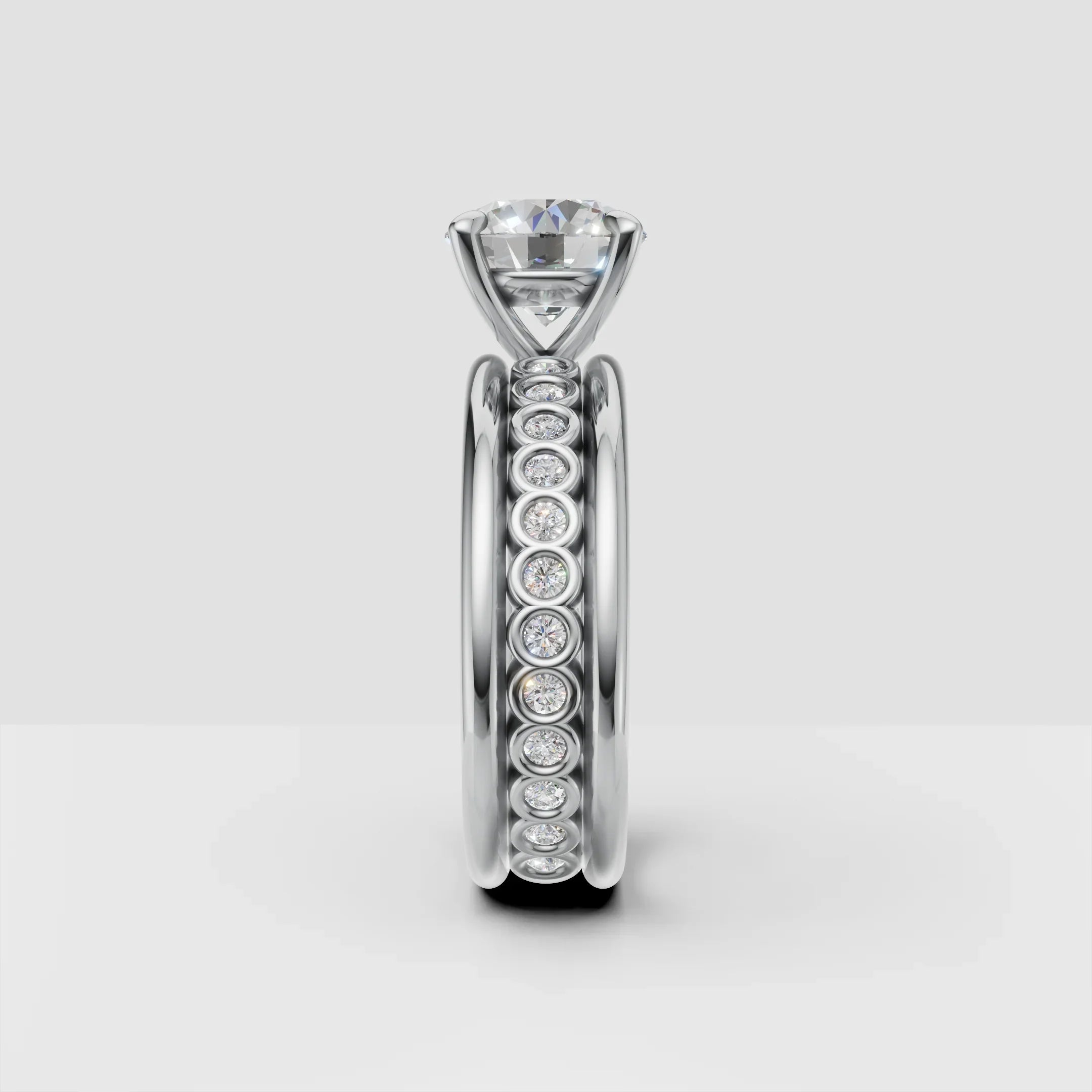 Platinum engagement ring with solitaire diamond and bezel set diamond band