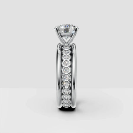 Platinum engagement ring with solitaire diamond and bezel set diamond band