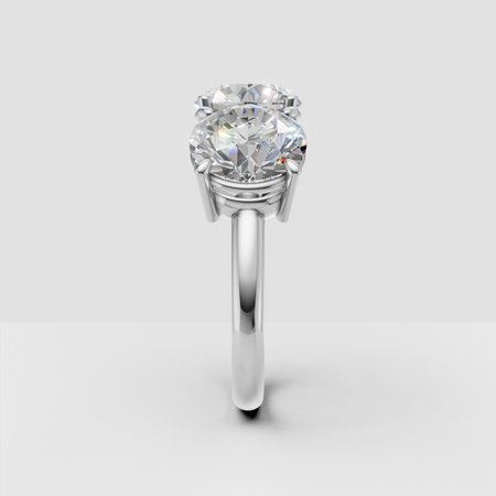 Two-stone diamond engagement ring with round brilliant-cut gems on white gold band