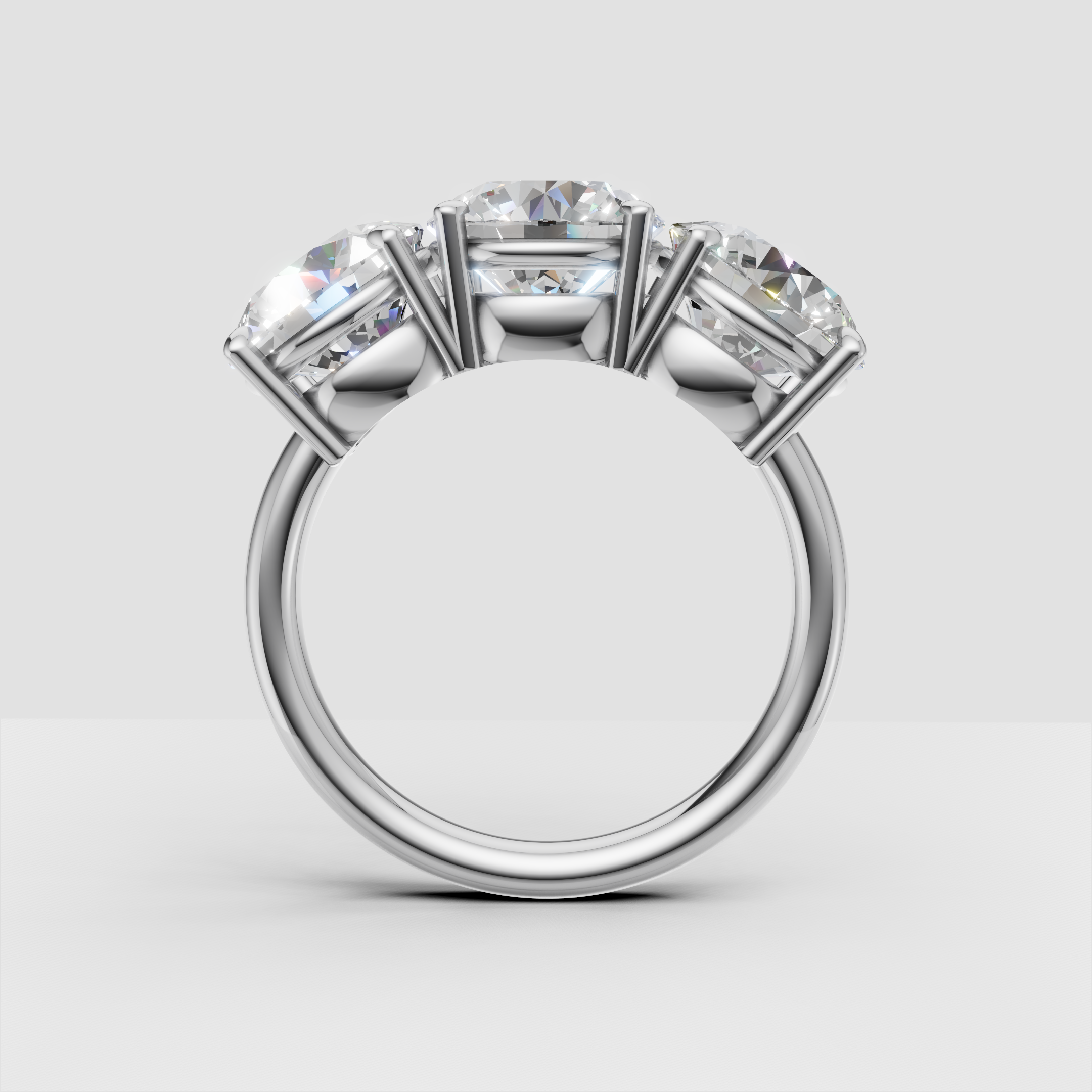 Four-stone diamond engagement ring in white gold, side profile view on white background
