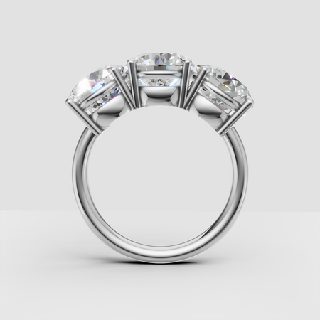 Four-stone diamond engagement ring in white gold, side profile view on white background