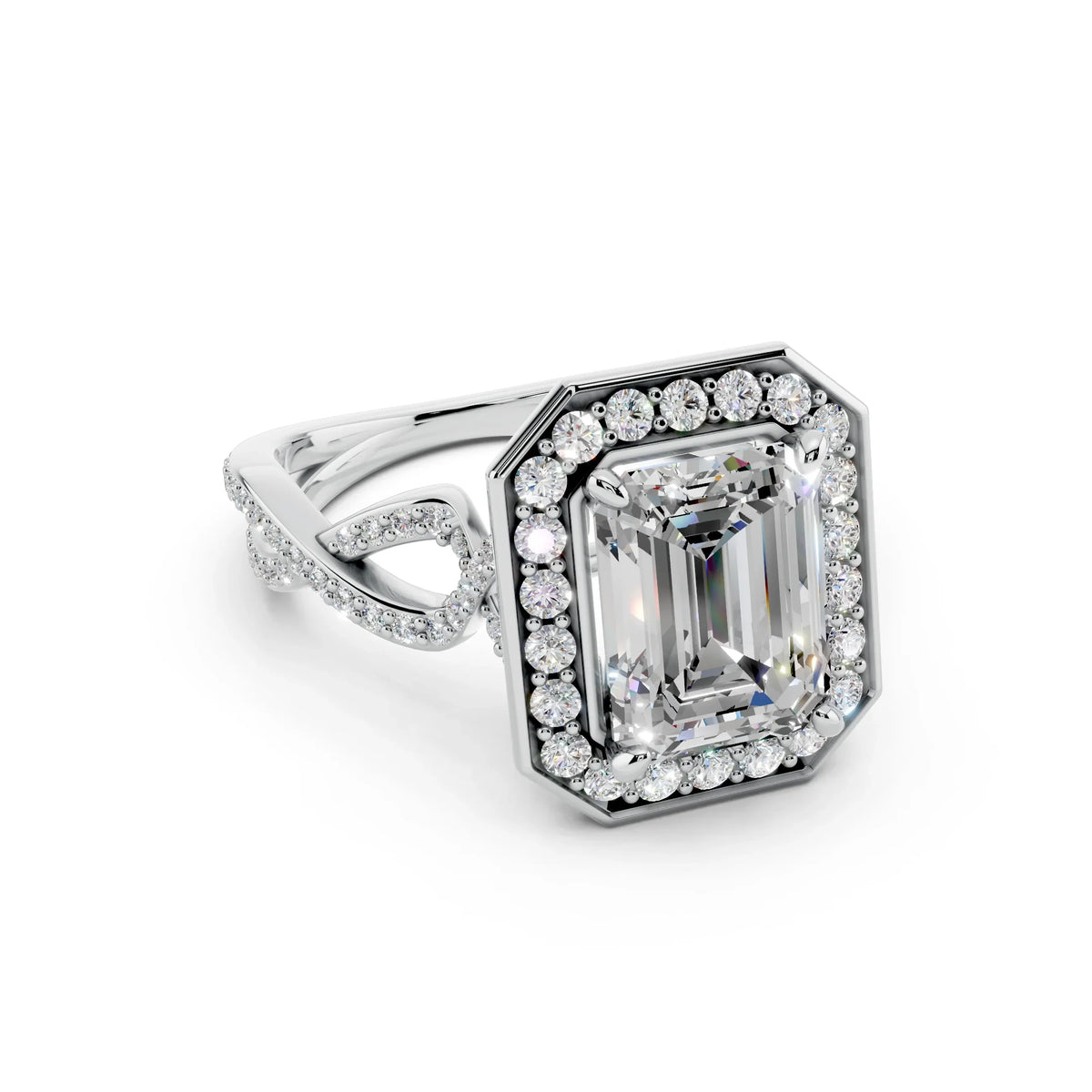 Emerald cut diamond halo engagement ring with twisted pavé band in white gold