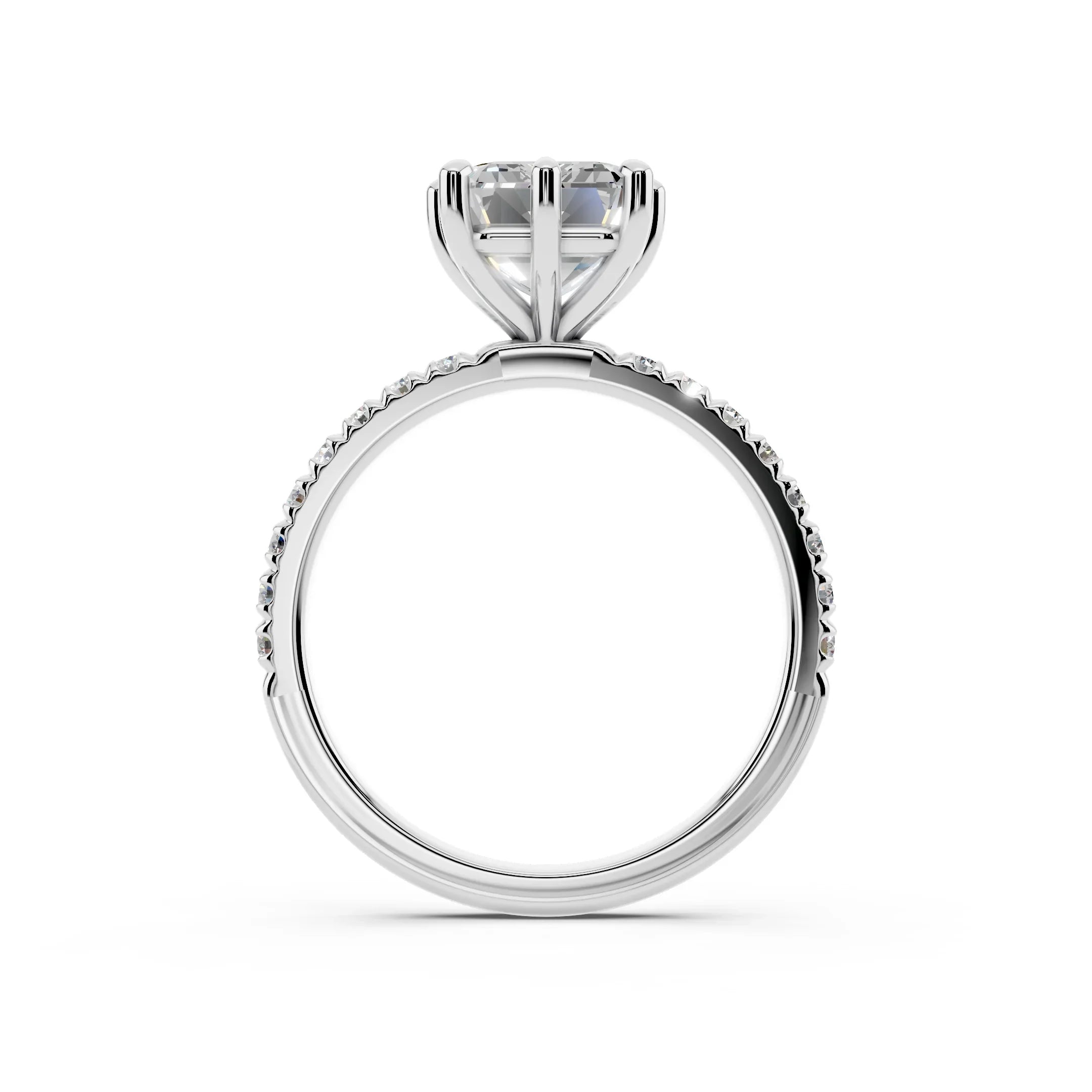 Side view of a solitaire diamond engagement ring with a pavé band in white gold