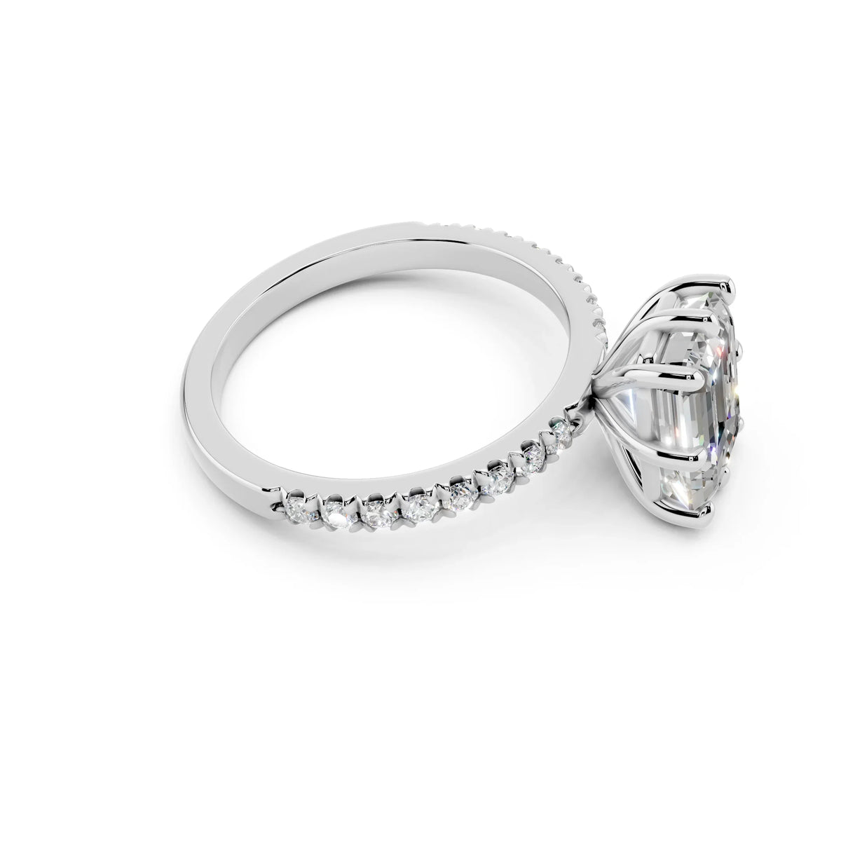 Platinum engagement ring with large oval diamond and pavé diamond band on white background