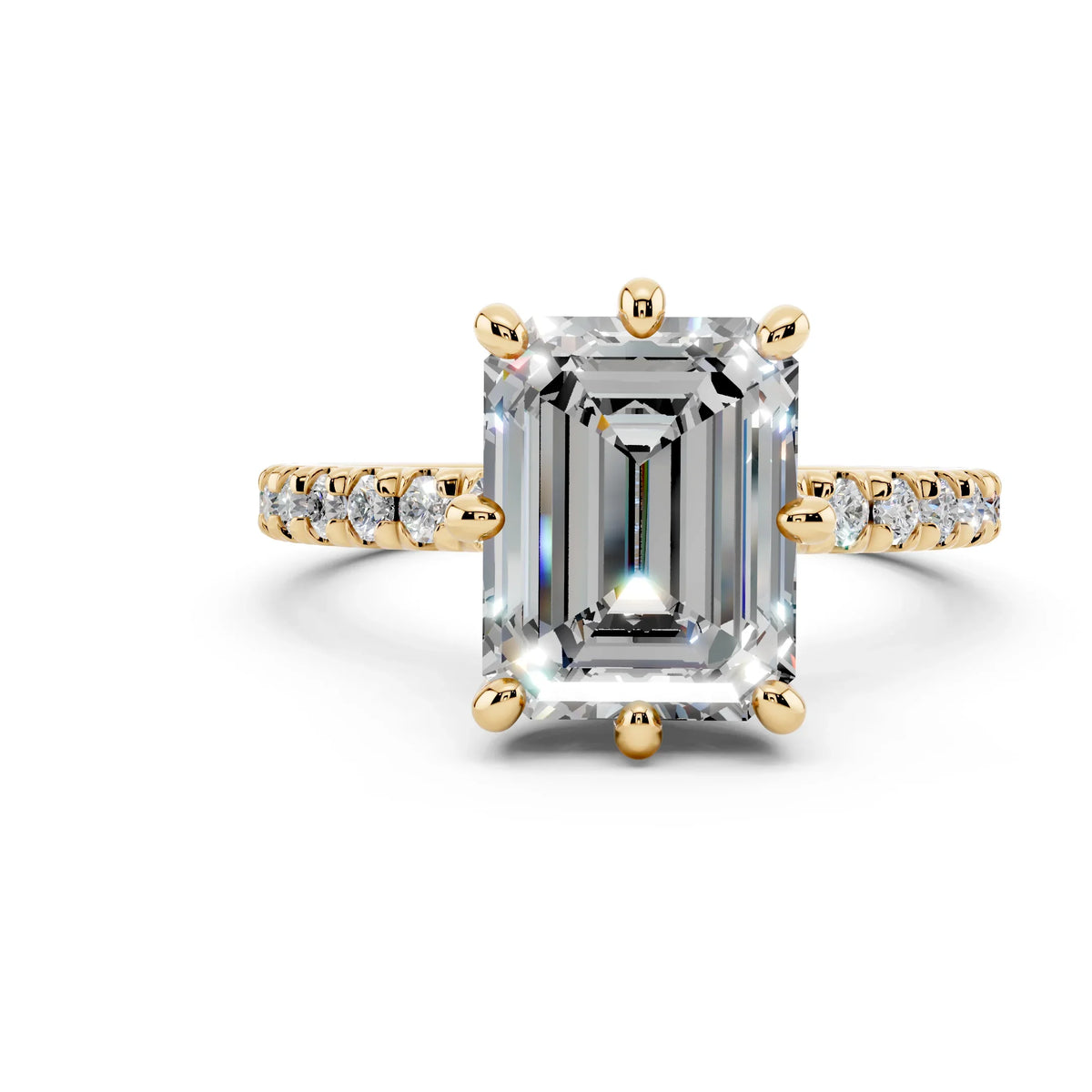 Emerald-cut diamond engagement ring with gold band and pavé side stones on white background