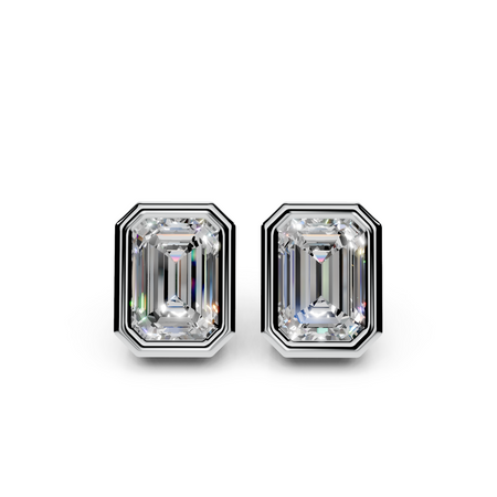 Emerald cut diamond stud earrings with geometric bezel settings on white background