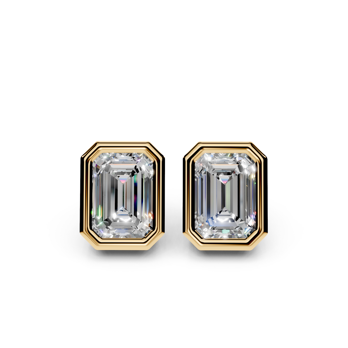 Emerald cut diamond stud earrings in yellow gold bezel settings on white background