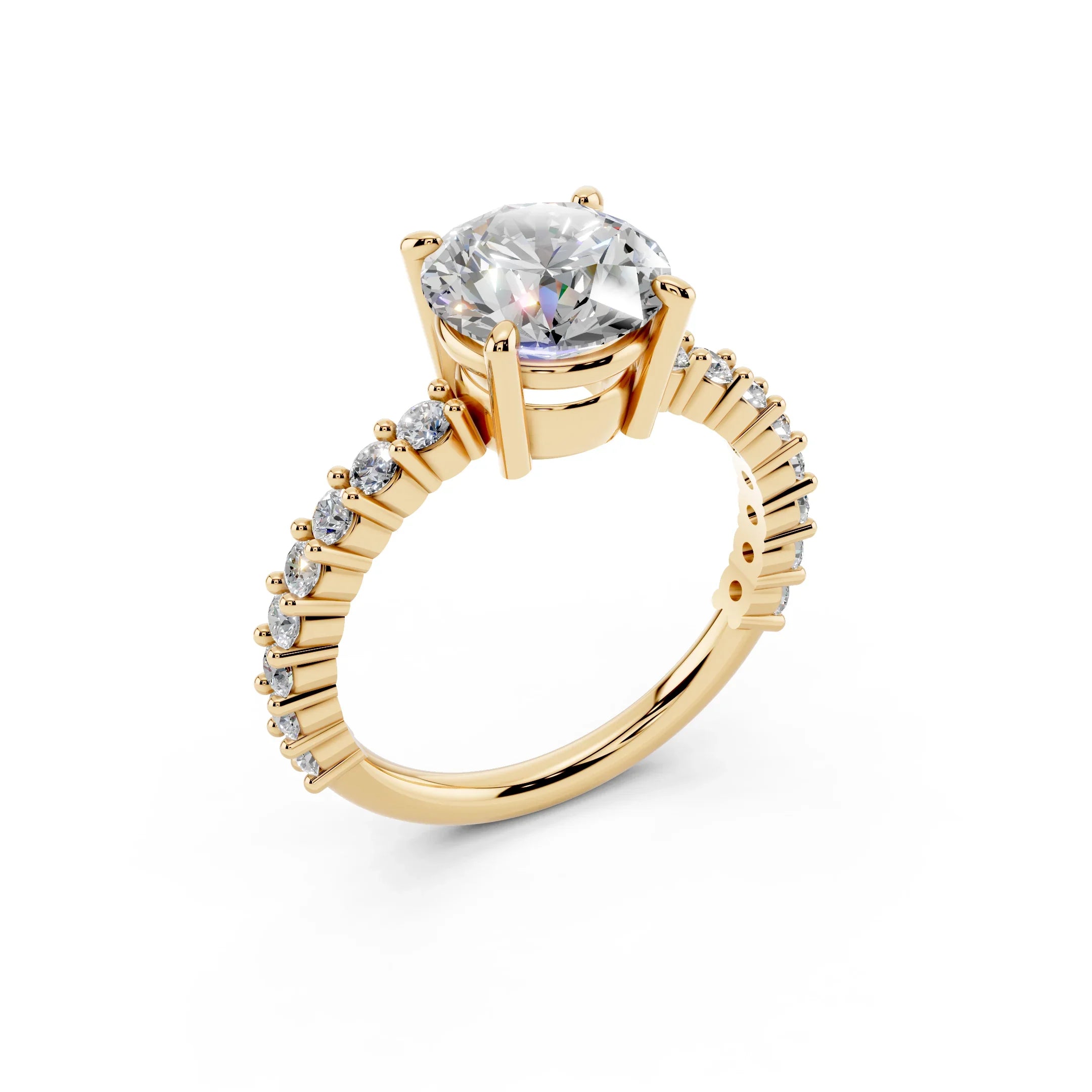 Gold engagement ring with round center diamond and pavé side stones on white background