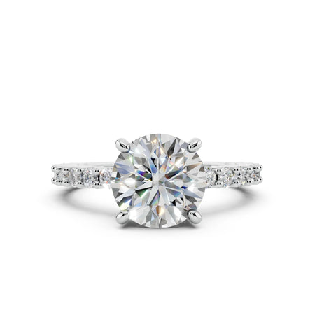 Round brilliant diamond engagement ring with pavé band in white gold