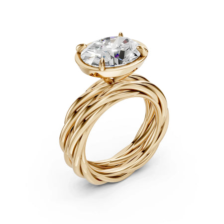 Yellow gold engagement ring with a twisted band and a marquise-cut diamond