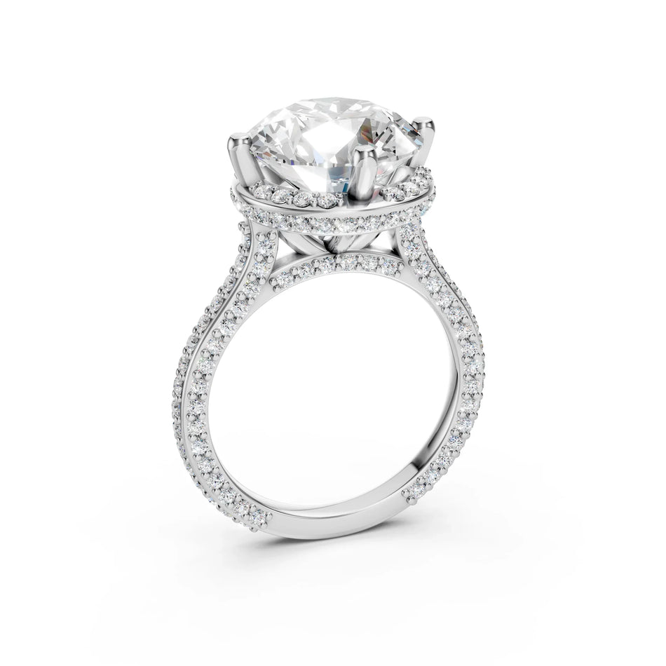 Round moissanite cathedral engagement ring by Bel Viaggio Designs with a diamond-encrusted band