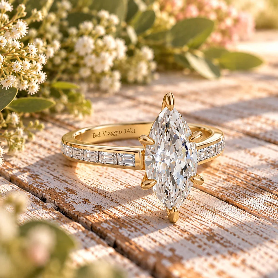 Marquise diamond engagement ring with baguette setting in yellow gold by Bel Viaggio Designs