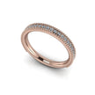 Rose gold wedding band with pavé diamonds and beaded milgrain edge on white background.