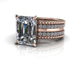 Emerald cut engagement ring with rose gold band and pavé diamonds