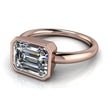 Emerald cut diamond solitaire engagement ring in a rose gold bezel setting