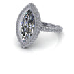 Marquise moissanite halo engagement ring with bezel setting and pavé diamond band